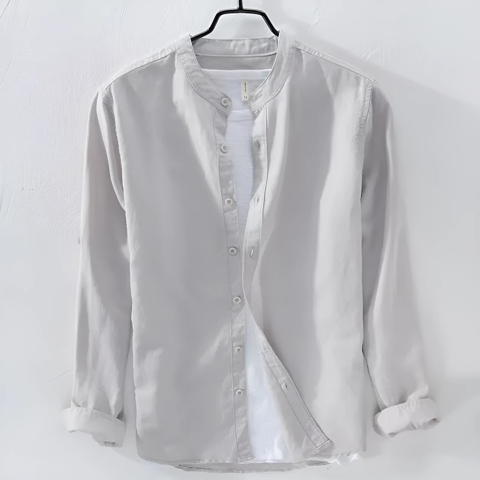 Man's loose-fit long sleeve casual shirt in linen-cotton blend, shown in dark blue colour.