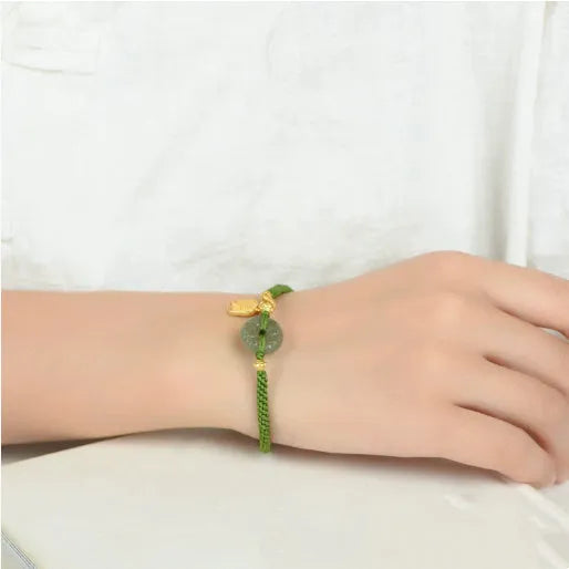 Hand-woven green rope bracelet with a Hetian jade safety buckle, adjustable sliding knot, women's National style accessory