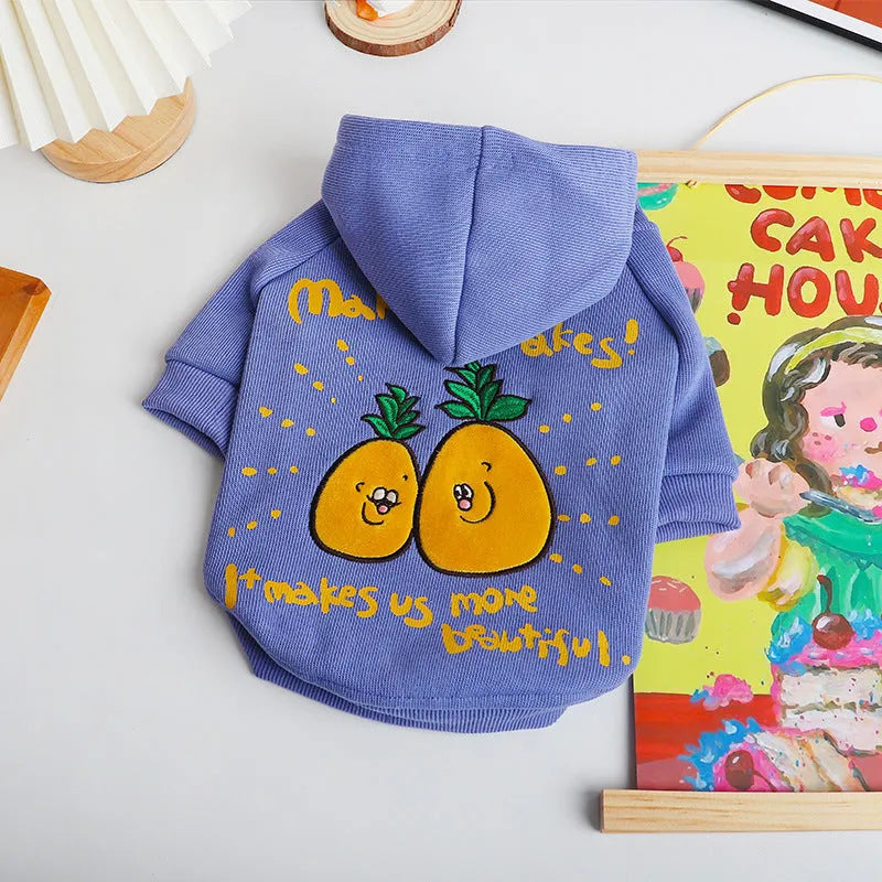 Winter cartoon printed plush pet hoodie in blue and purple made from cotton, shown on a pet