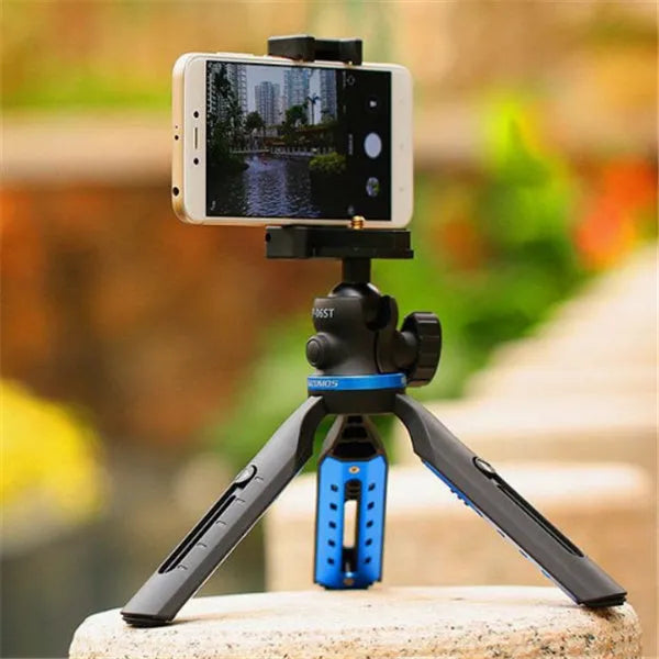 Black desktop phone tripod stand compatible with iPhone models on a desk