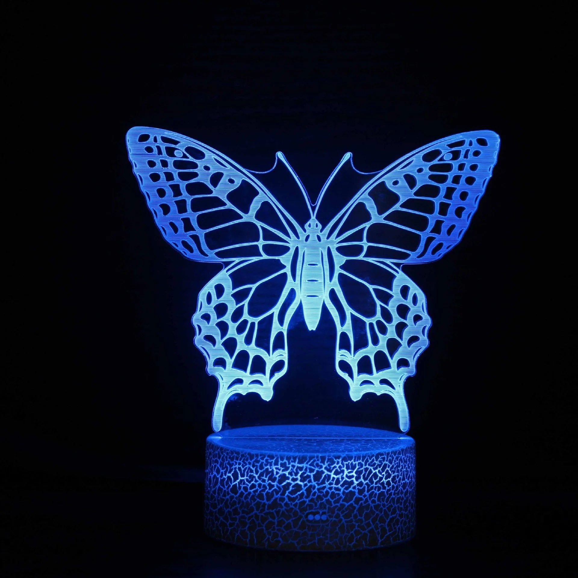 Acrylic 3D table lamp with colourful crack base design and touch controls on wooden surface