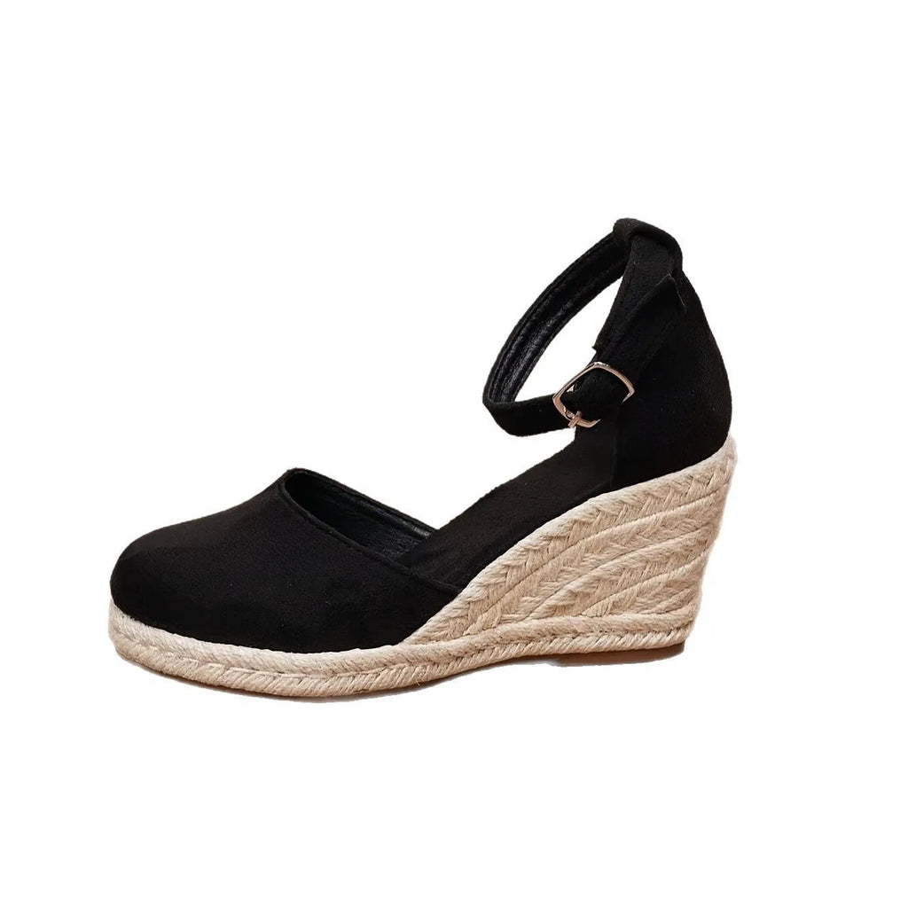 Women's apricot suede Roman style wedge sandals with buckle closure and rubber sole