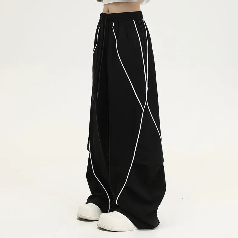 Black pleated wide-leg hip hop sports trousers with a striped pattern.