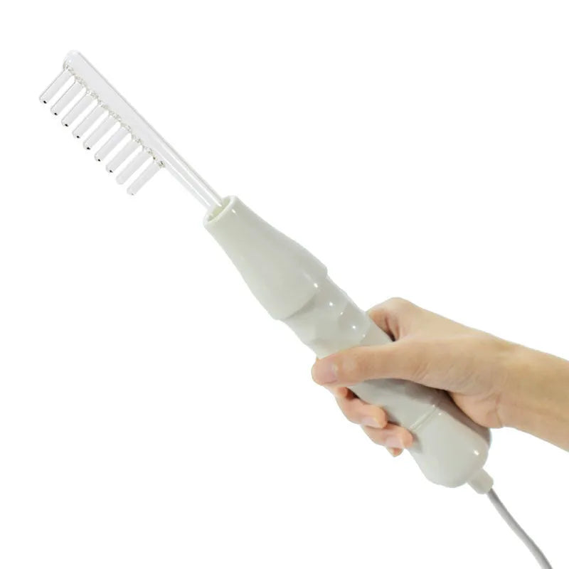 White high-frequency electrotherapy comb with four glass electrodes in packaging