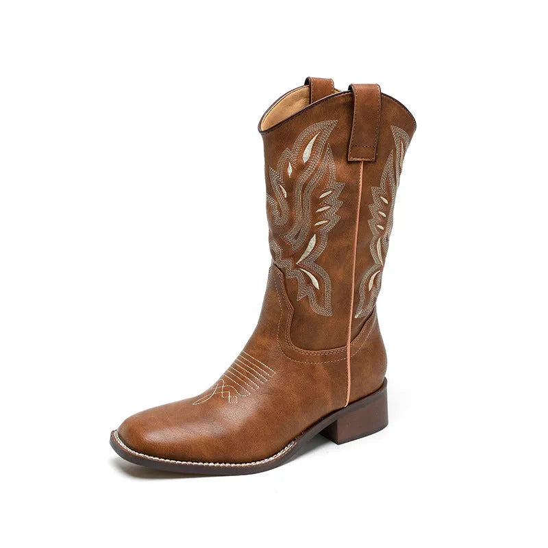 Brown women's embroidered mid-calf Martin boots on a white background, showing round toe and low square heel.