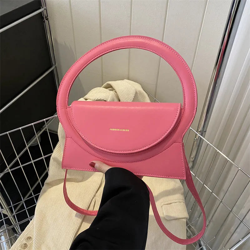 PU leather messenger bag in horizontal square shape with phone pocket and stitching details