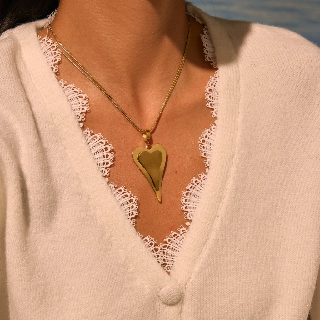 Stainless steel necklace with double heart pendant and snake bones chain design