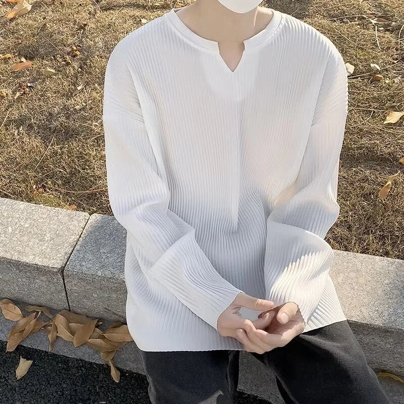 Plus size women's striped texture draping solid colour pullover top in black, loose fit, long sleeves, polyester knit