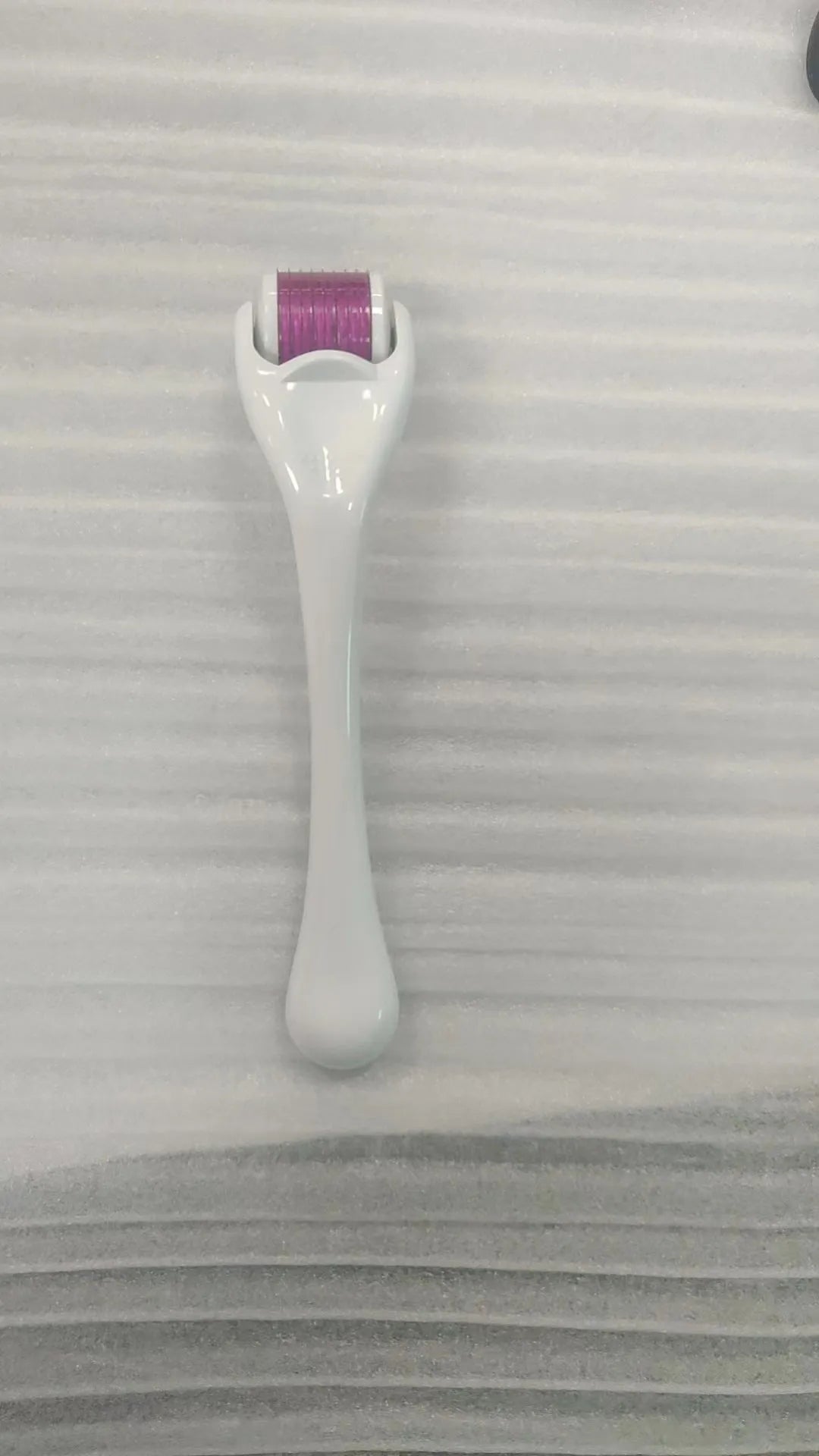 540 needle derma roller with black handle and coloured wheel, showing 0.25mm 0.3mm size options for micro-needling.
