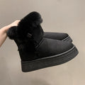 Women's mid-calf fleece-lined snow boots in brown with black rubber sole and bow tie detail