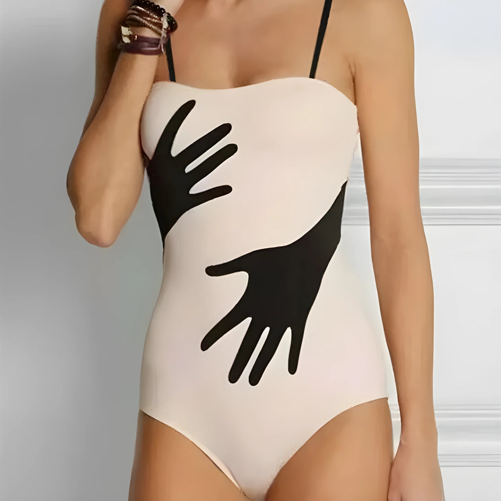 Women's one-piece bikini swimsuit with a gauze skirt, shown on a model.