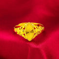 Gold coloured open diamond flower shape ring with geometric textured details on a brass base.