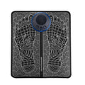 Leather foot massage cushions with a wireless remote control on a wooden floor
