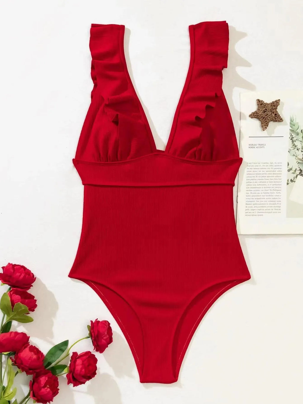 Women's one-piece solid-colour swimsuit with ruffled shoulder straps and back lace, black colour