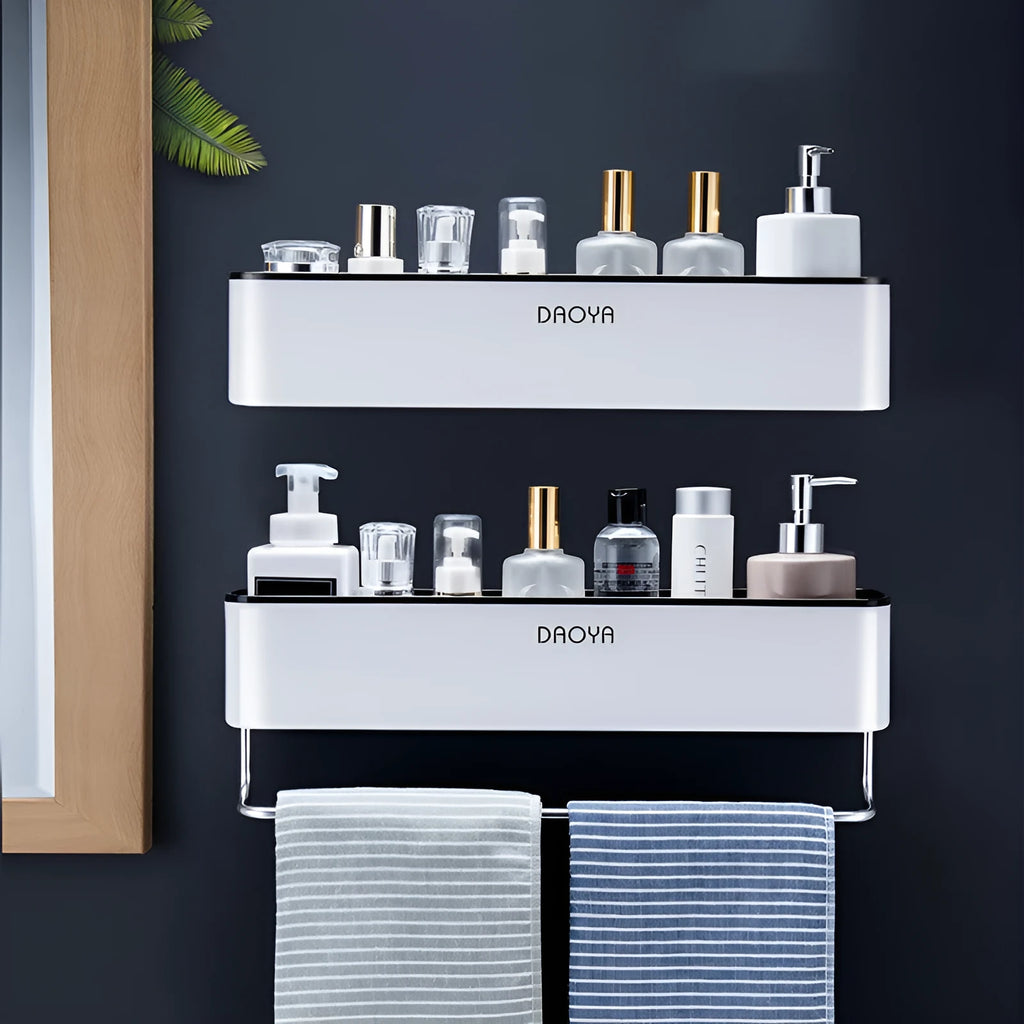 Hole-free plastic bathroom shelf mounted on wall holding shampoo and shower gel bottles in black finish
