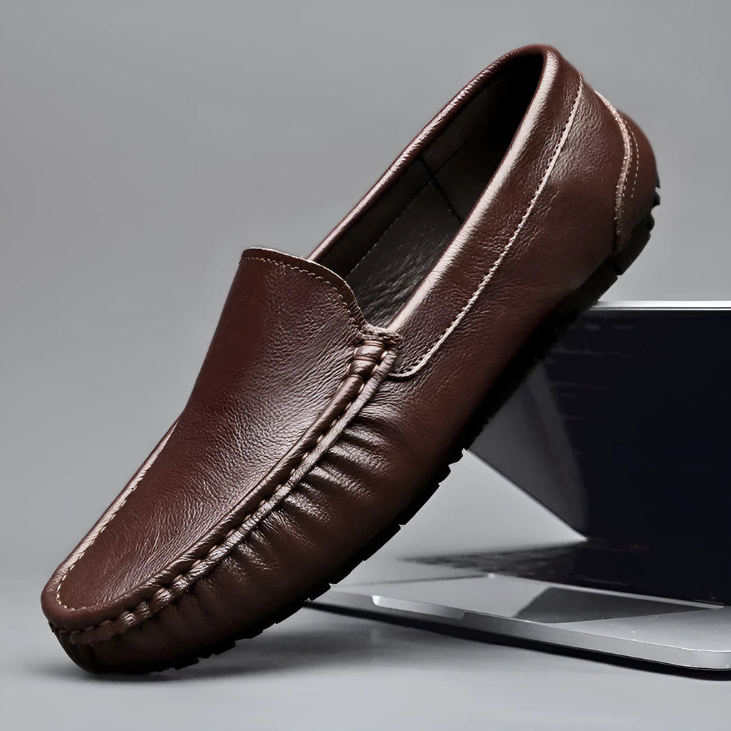 Mens brown casual driving shoes with leather upper, round toe, and stitching detail on a white background