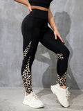 Woman wearing black ribbon letters colour contrast patchwork high waist yoga leggings with pocket