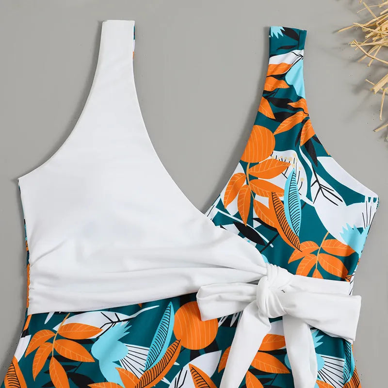 High-waist one-piece swimsuit with printed pattern in white or black colour options