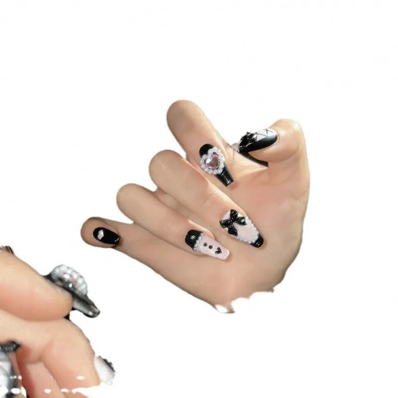 Black and pink heart hand-painted artificial nail set with cat's eye design in four sizes