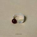 Electroplated alloy diamond-shaped stewed pork motif ring and bracelet set on a background.