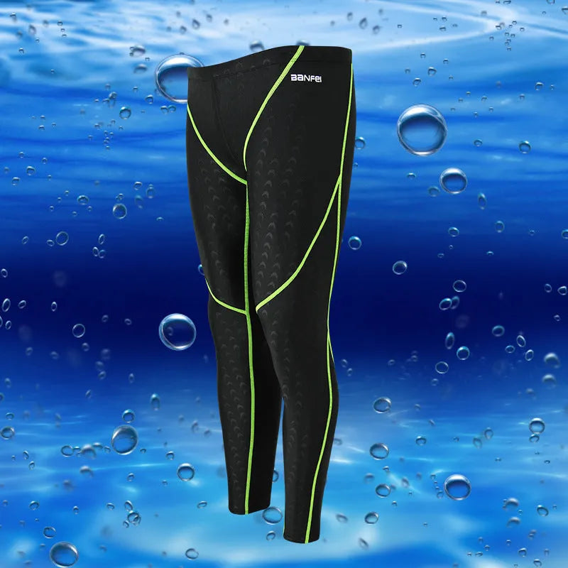 Men's nylon swimming trunks in black with grey trim, showing cropped brief style with mesh lining