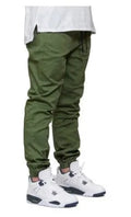 Men's casual stretch joggers in black with mid-waist drawstring closure and tight-fit leg