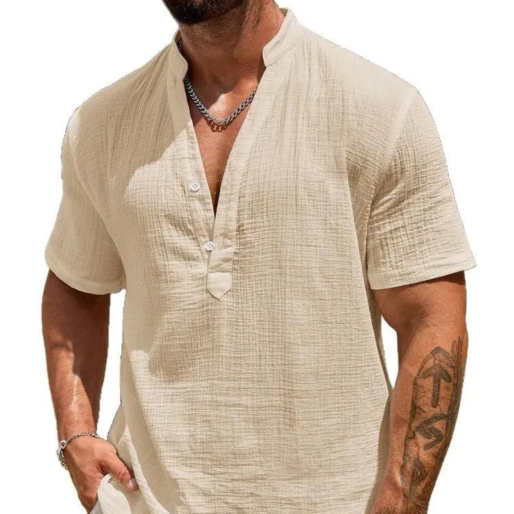 Men's solid colour short-sleeved shirt with stand collar in light blue, laid flat.