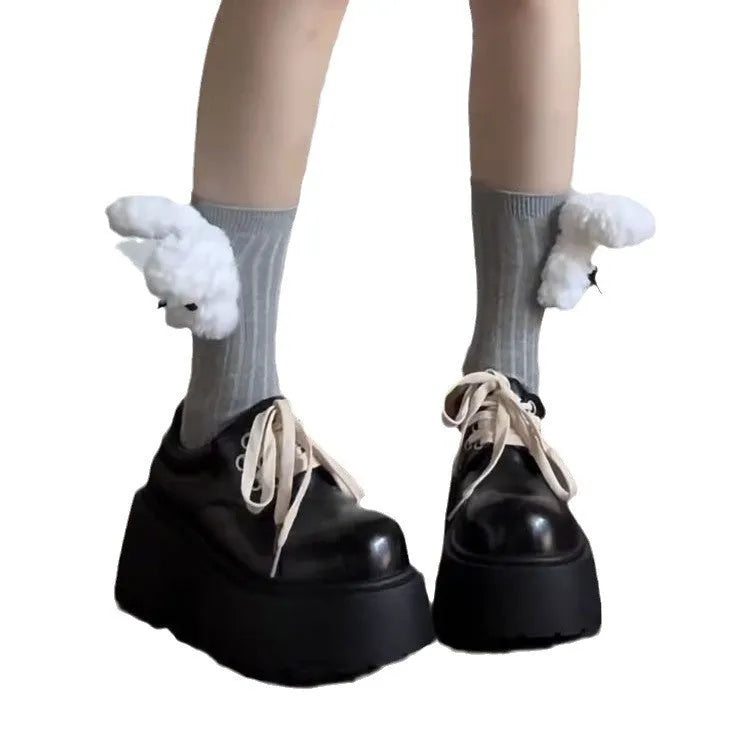 Matte black women's low-top shoes with a chunky 6-8cm heel and thick rubber sole on a white background.