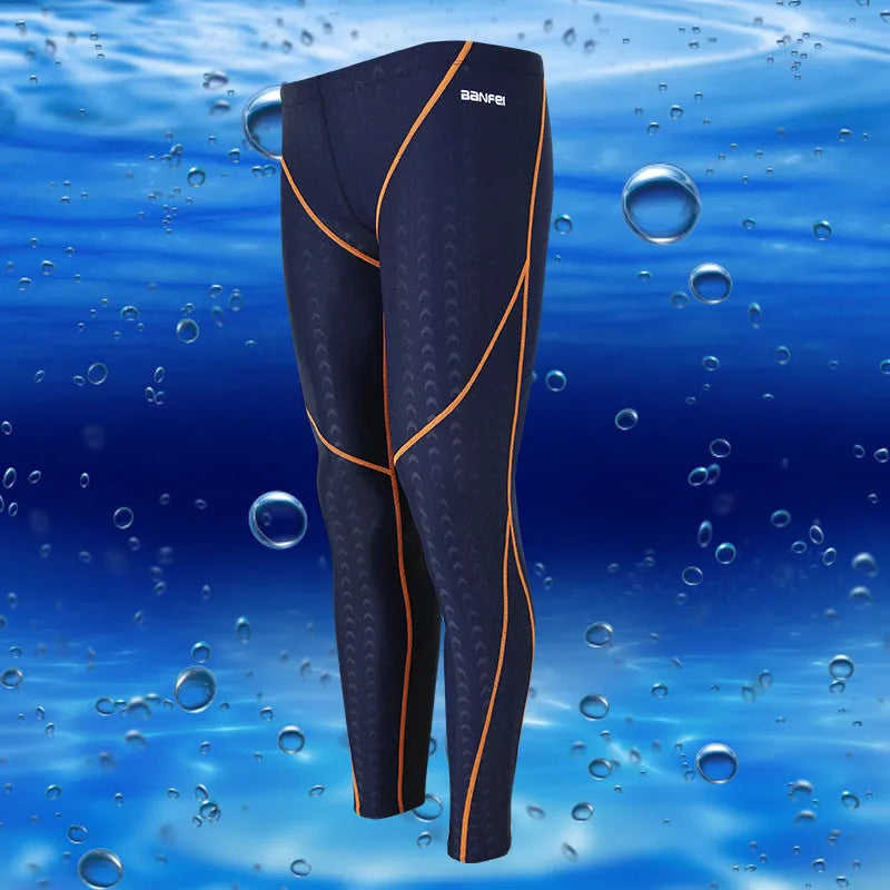 Men's nylon swimming trunks in black with grey trim, showing cropped brief style with mesh lining