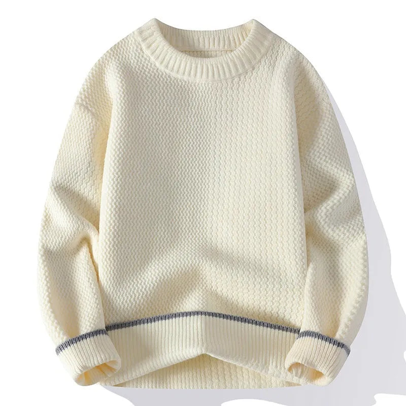Man wearing a loose grey round neck pullover sweater, casual autumn outfit