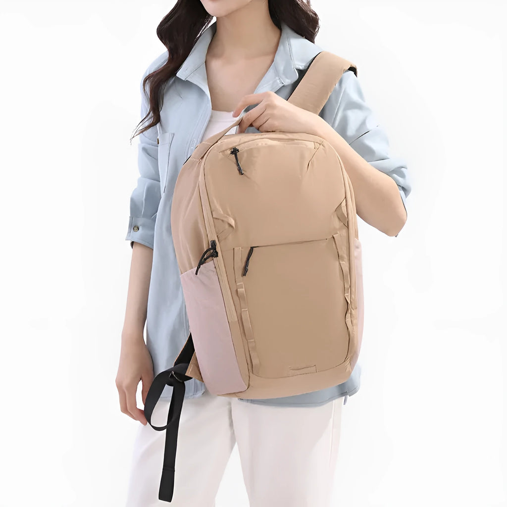 Waterproof Taslan composite cloth backpack in solid colour with spliced design, available in beige, for business commute and leisure travel under 20 litres