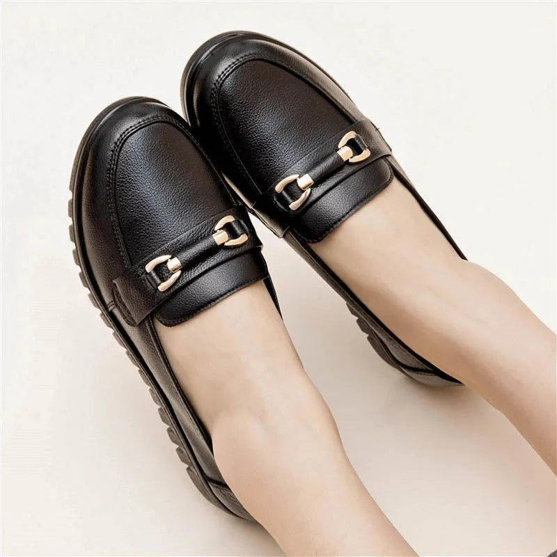 Black women's casual leather pumps with a round toe and low flat heel