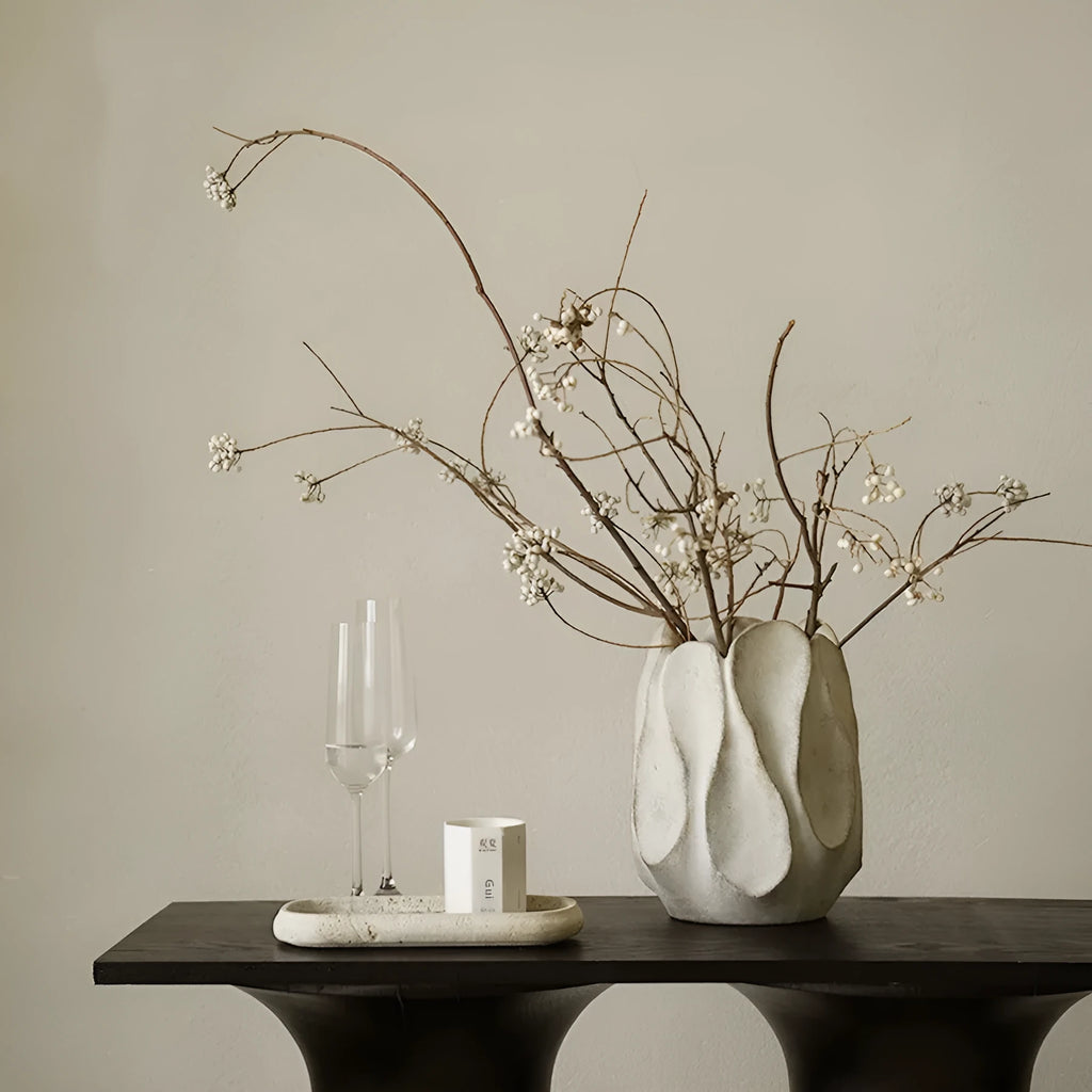 Handmade irregular ceramic vase in magnesium clay, shown in high and low style options.