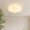 Modern minimalist cloud chandelier with tricolor light, 42mm diameter, ceiling mounted in a bedroom