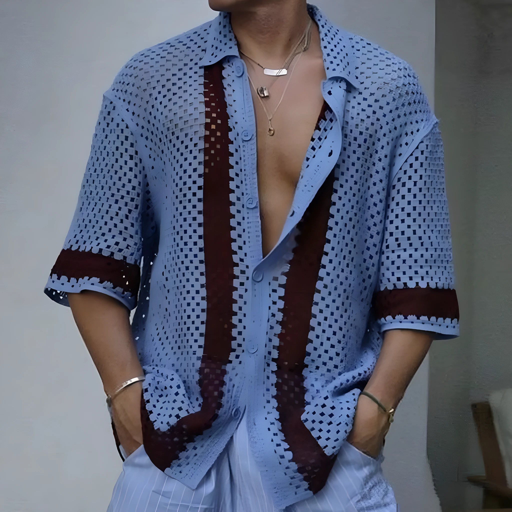 Men's blue hollow knit viscose short sleeve cardigan on a plain background