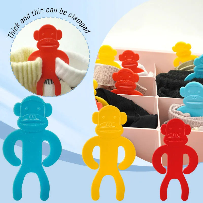 Plastic socks storage clips in blue, red, and yellow colours for laundry organisation