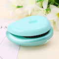 Pink electric sound wave vibration magnetic massage comb with ergonomic handle and negative ion function