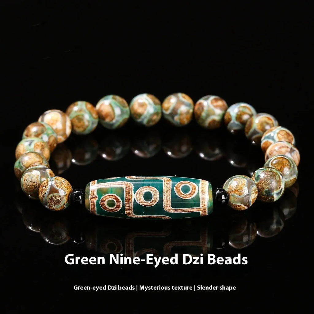 Handmade green dzi bead barrel shaped bracelet with 8mm natural agate beads on white background