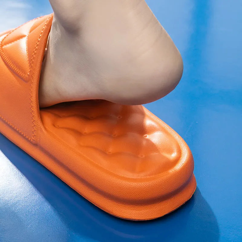 Soft EVA bath slippers in multiple colours showing thick non-slip sole.