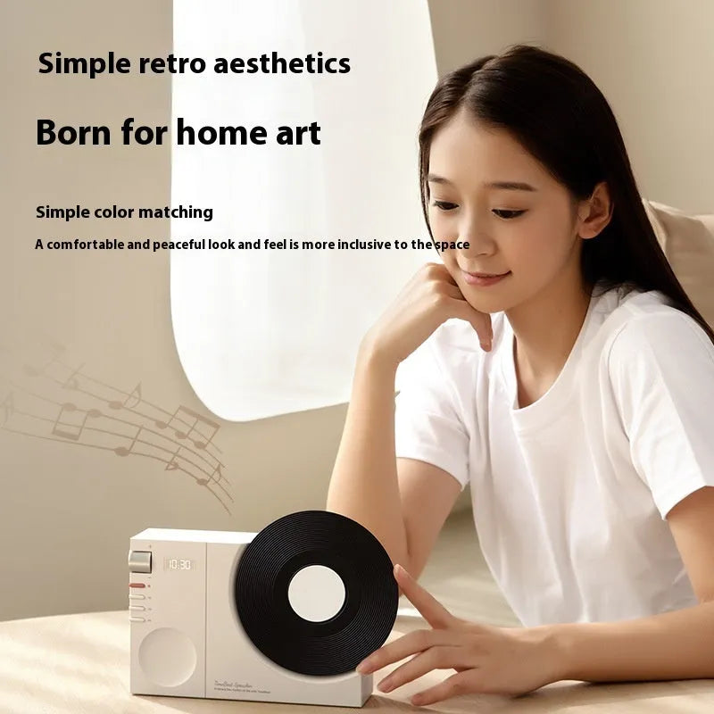Mini portable Bluetooth speaker in coral pink colour with USB port and memory card slot.