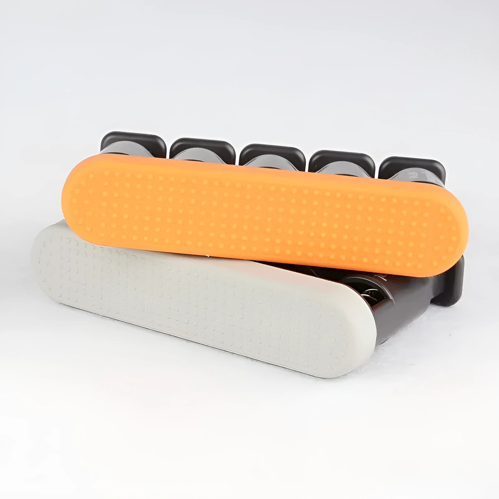 Grey and orange silicone finger trainer for piano guitar hand muscle development