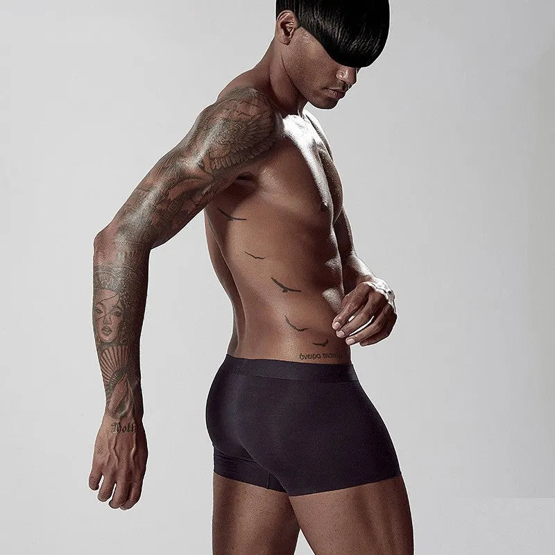 Men's seamless modal briefs in solid colour with mid waist design for body shaping