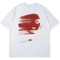 A white loose-fit cotton t-shirt with short sleeves and a round neck on a hanger.