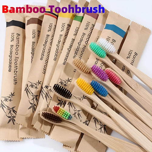 10 bamboo toothbrushes with soft charcoal bristles in assorted colours arranged fanned out