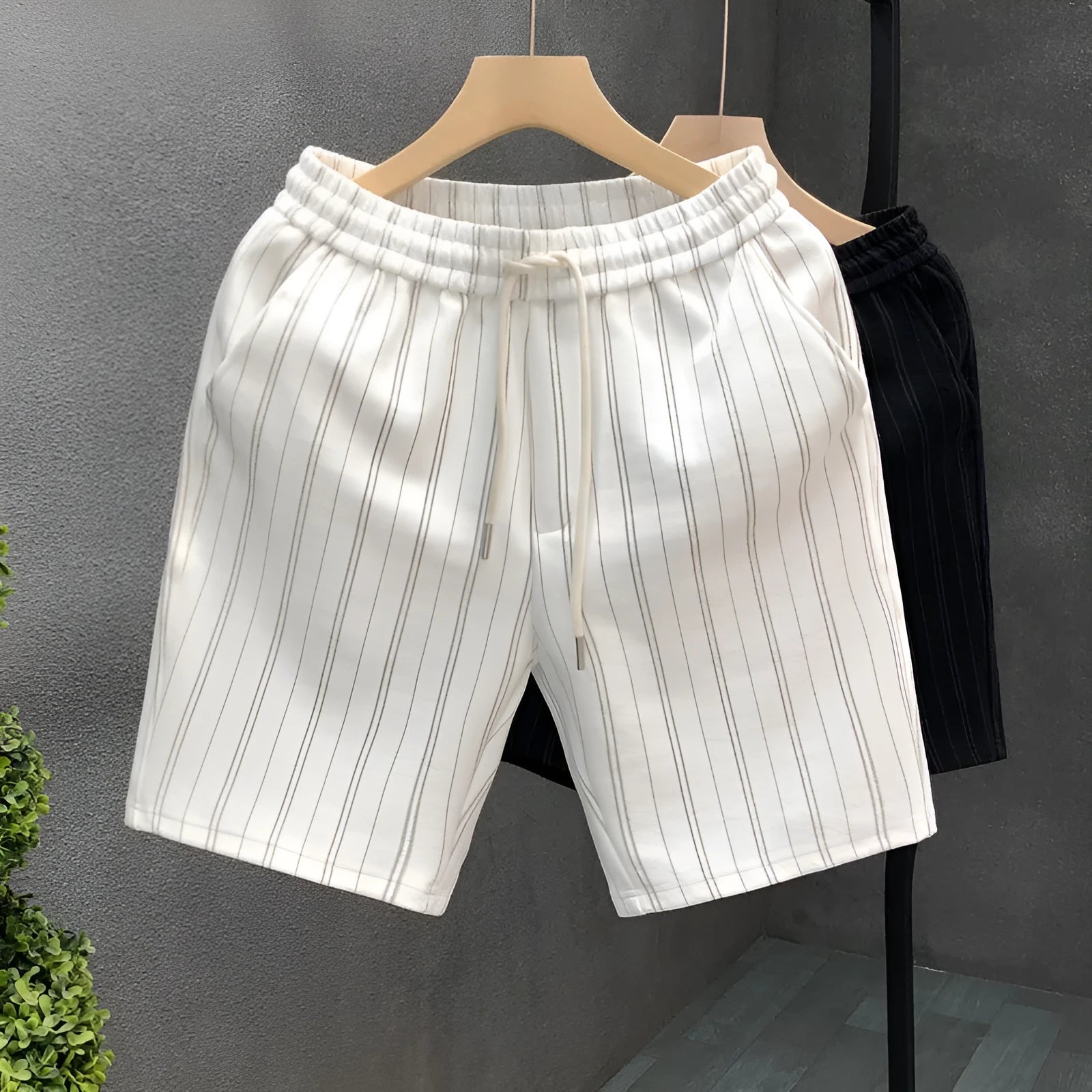 Men's black and white striped fleece-lined casual shorts with straight leg and ankle banding
