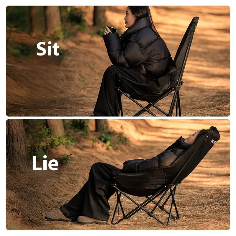 Night Black Oxford cloth portable folding camping recliner chair on grass.