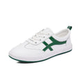 White and black casual Korean style low-top sneakers with sequin detailing, first layer cowhide upper, elastic band closure, and rubber sole