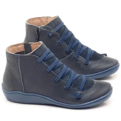 Women's casual flat booties with wedge heel and round toe in various colours including leopard print.