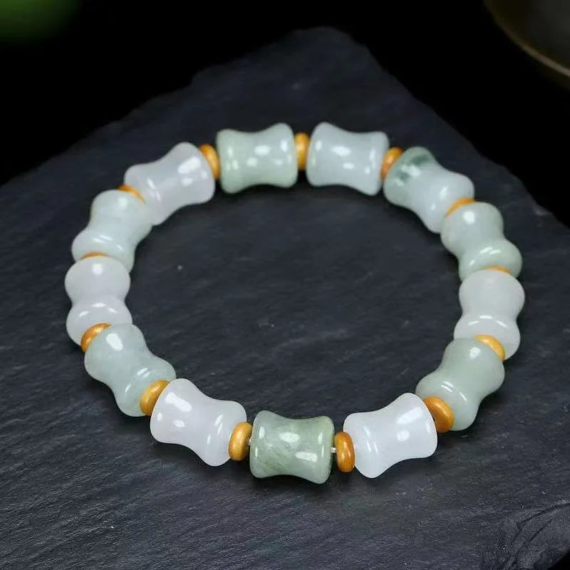 Tianshan Emerald natural chalcedony beaded bracelet with diamond jade centre and coconut shell beads on a white background