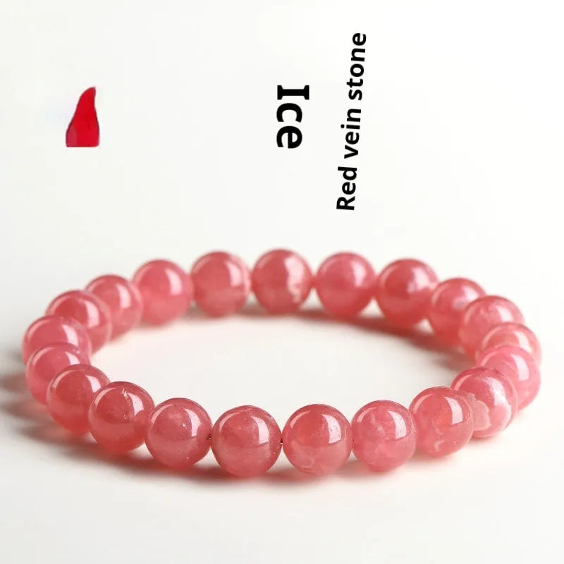 Women's red rhodochrosite crystal bracelet with geometric beads and a longevity lock clasp.